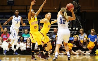 Tricia Liston looks into the post for center Elizabeth Williams, who was one of Duke's many post weapons to excel against Winthrop.