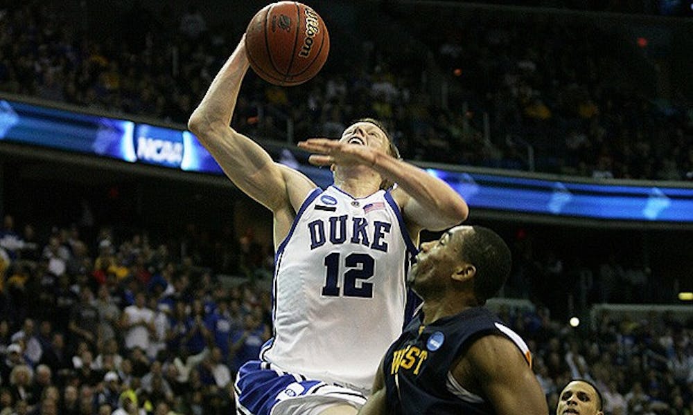 Duke’s Kyle Singler and West Virginia’s Da’Sean Butler will likely be matched up on defense Saturday.