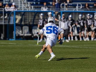 Jake Naso scoops the ball and runs with it during Duke's season opener against Bellarmine.