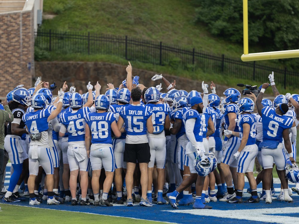 The Duke football team huddles after its 2024 Spring game.