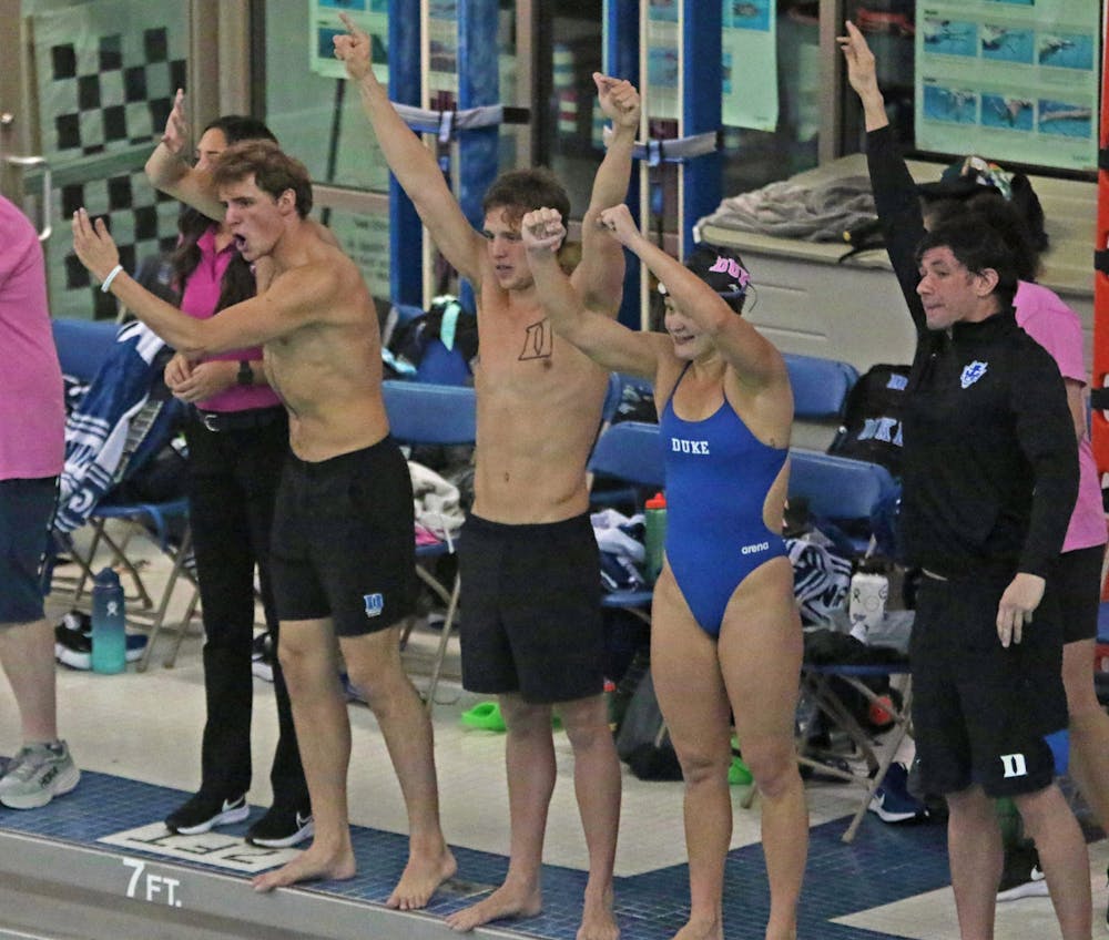 Duke swimmers celebrate against Virginia Tech.