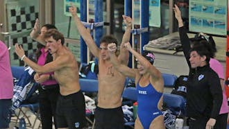 Duke swimmers celebrate against Virginia Tech.