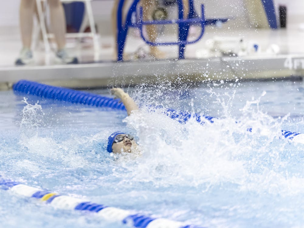 Michael Jiang tied for first place in the 100-yard backstroke. 