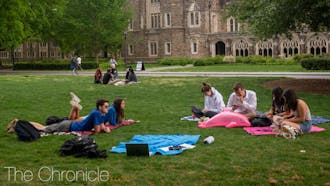 Friends studied on the quad, enjoying for their last two weeks together before they head home for the summer.