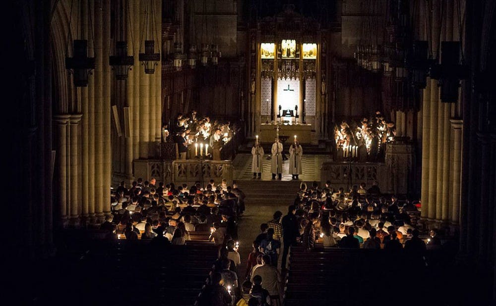Worshipers at Duke Chapel participate in the All Hallows' Eve service, which takes place by candlelight Oct. 31.