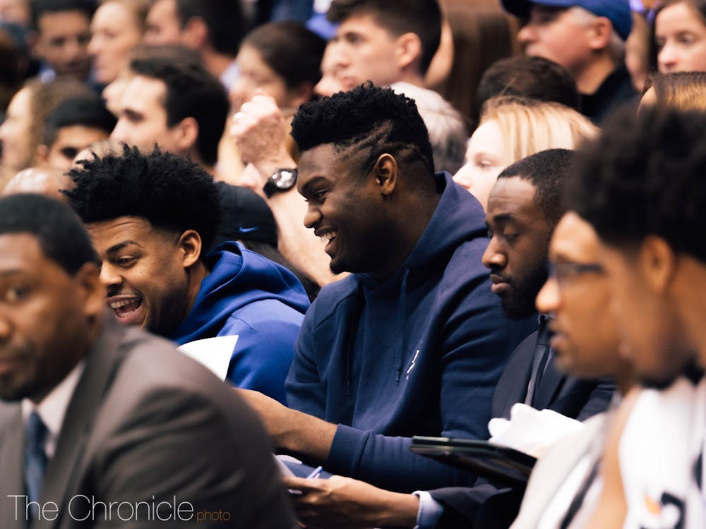 Zion Williamson enjoyed the company of two NCAA champions, Quinn Cook and Tyus Jones, at Duke's win.