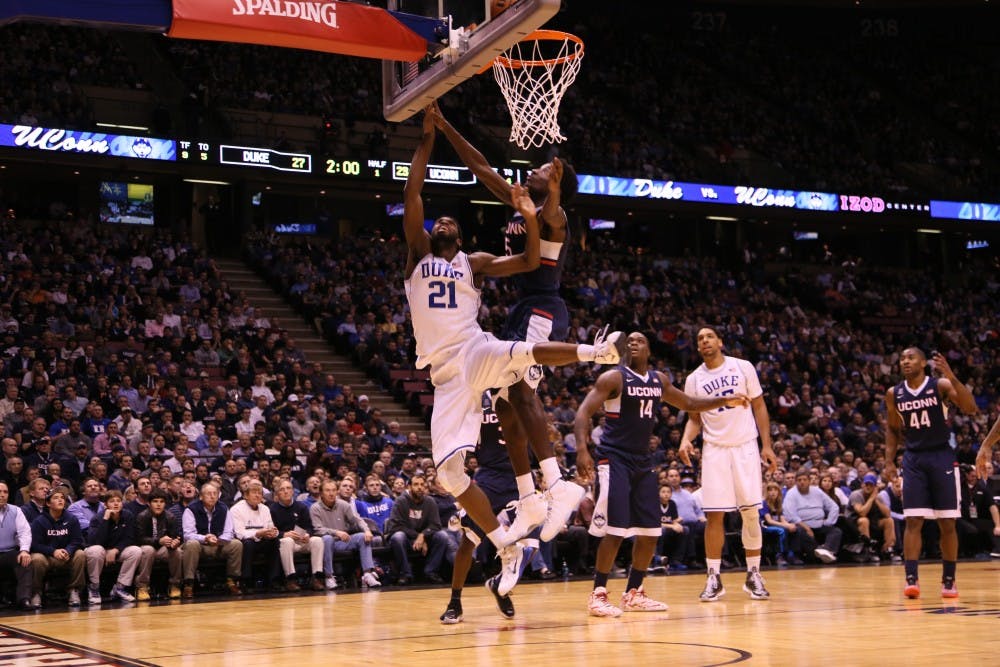Captain Amile Jefferson scored 11 points and grabbed 13 rebounds to help No. 2 Duke top Connecticut at the IZOD Center.