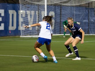 Kat Rader dribbles the ball on the edge of the box against Notre Dame.