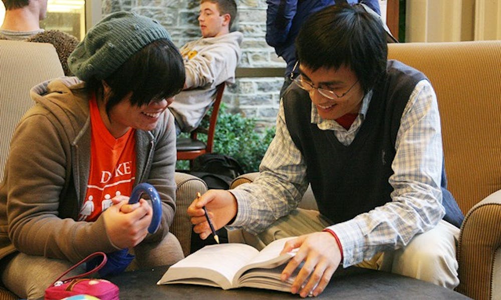 Senior Shirley Lung (left) holds her weekly conversation with Ph. D. candidate Lin Wang (right) through the Duke Language Partners program. Lung said the meetings help expand her thinking and improve her language skills.