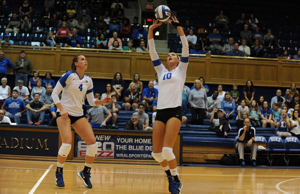 Elizabeth Campbell (right) recorded a game-high 23 kills as Duke notched a 3-1 comeback victory against Illinois.