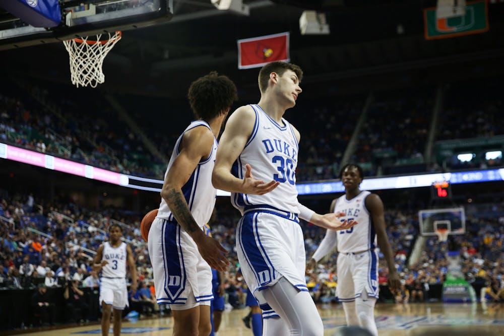 <p>Kyle Filipowski shrugs after an and-one in the second half of Duke's blowout win Thursday at the ACC tournament.</p>