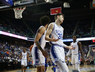 Kyle Filipowski shrugs after an and-one in the second half of Duke's blowout win Thursday at the ACC tournament.