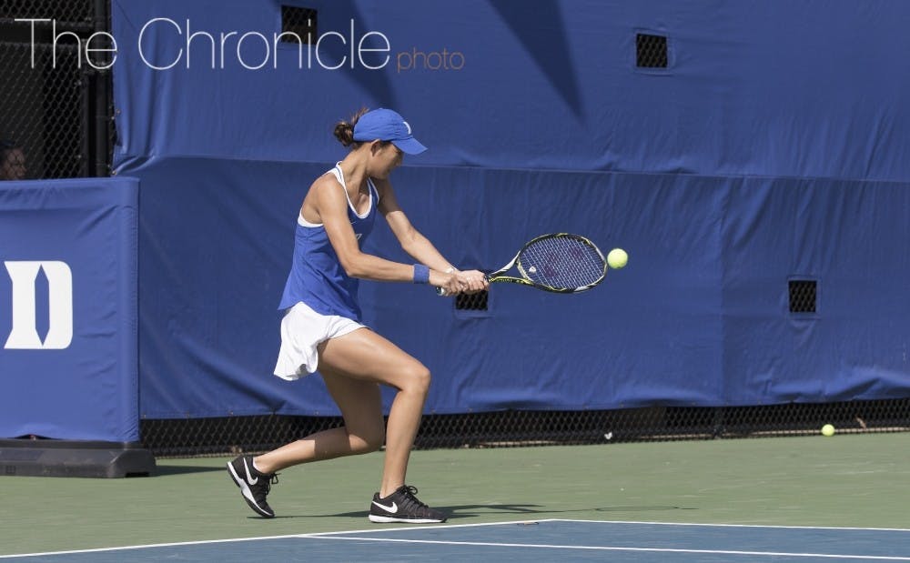 <p>Freshman Meible Chi breezed past No. 13 Erin Routliffe 6-2, 6-3, to advance to the Round of 32.</p>