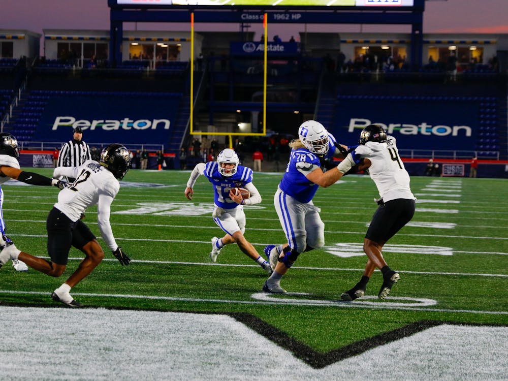 Military Bowl MVP Riley Leonard weaves toward the end zone in the closing minutes for his second rushing score of the game, putting Duke up 30-13.