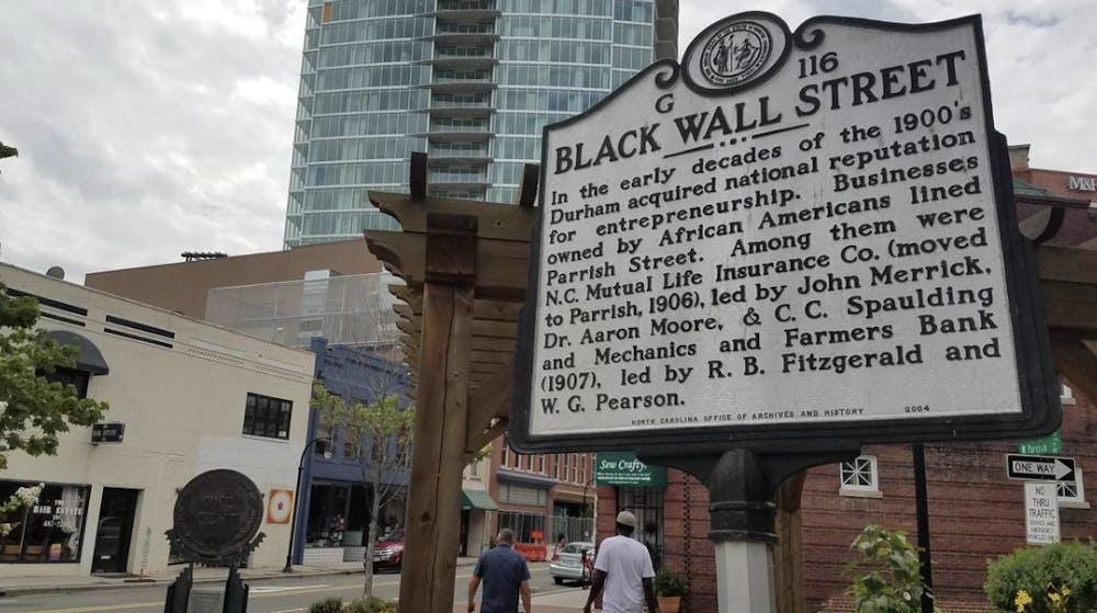 A sign today in Durham commemorating the historical significance of Durham’s Black Wall Street. Courtesy of the Durham Herald-Sun.