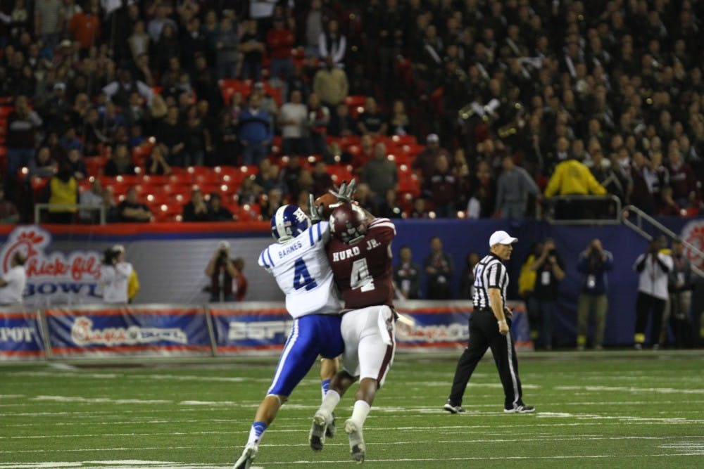 Toney Hurd, Jr. returned an interception for a touchdown in the closing minutes to give Texas A&M a 52-48 comeback victory against Duke in the Chick-fil-A Bowl.