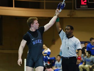 Redshirt senior Conner Hartmann captured his second straight ACC title at 197 pounds Sunday night and will join three other Blue Devils at the NCAA championships at Madison Square Garden later this month.