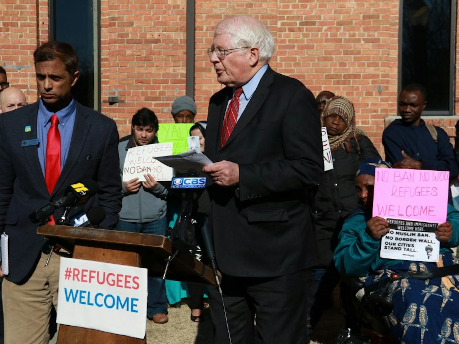 Rep. David Price, a Democrat from North Carolina's fourth congressional district, spoke with refugees at an event at Smith Warehouse in 2017.