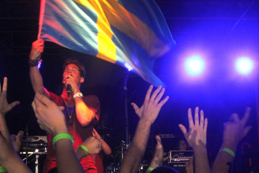 Musician Basshunter waves a Swedish flag while performing for a crowd at the Spring 2012 LDOC celebration. This year's LDOC committee just began meeting to plan the Spring 2013 celebration.