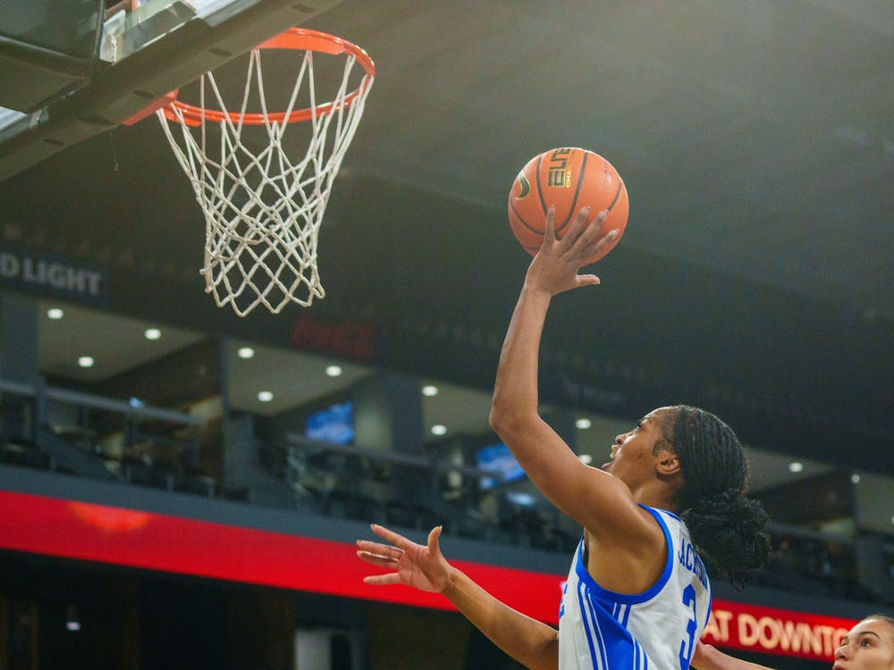 Ashlon Jackson finishes with her left hand against Kansas State. 