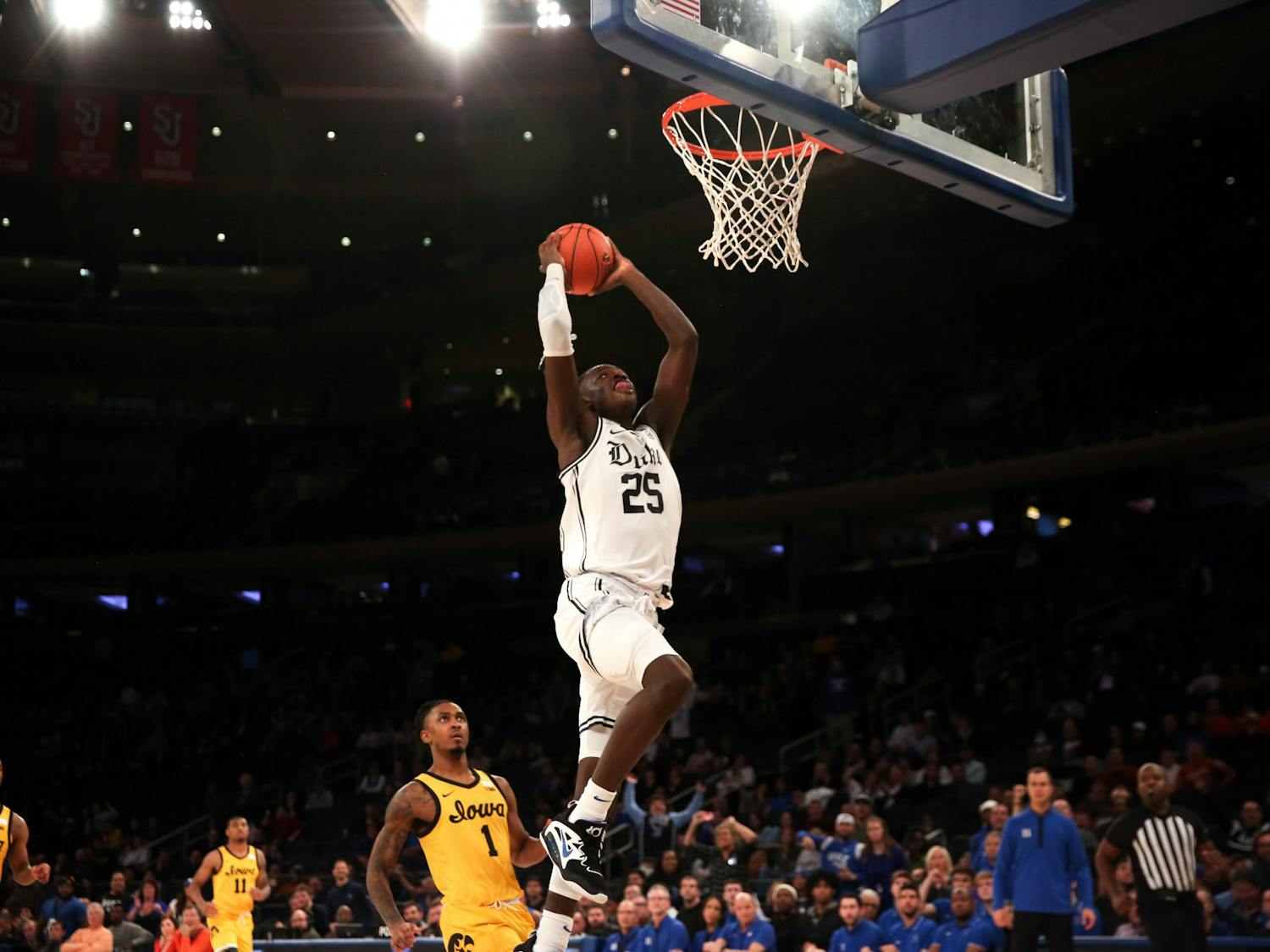 Mark Mitchell soars up for a dunk in Duke's win against Iowa at Madison Square Garden.