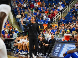 Head coach Jon Scheyer directs from the sidelines in Duke's ACC tournament semifinal victory against Miami.