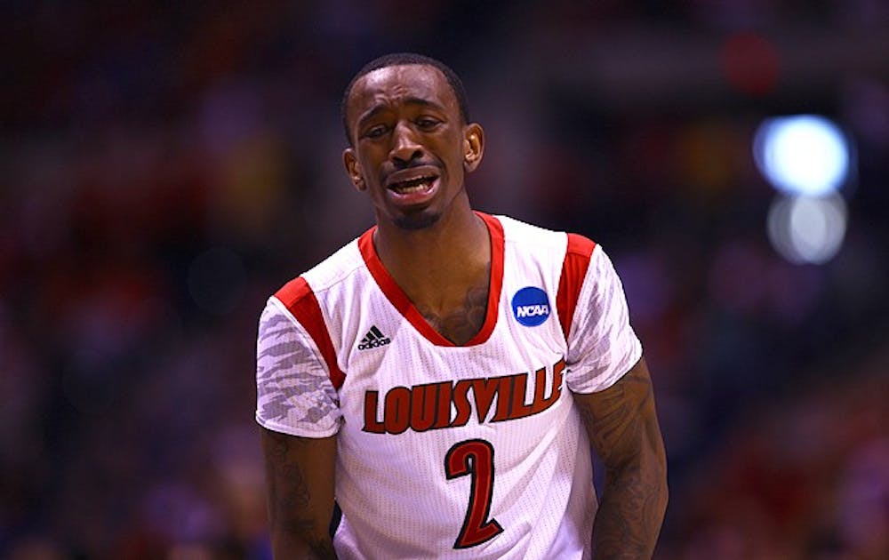 Louisville star Russ Smith reacts emotionally to Kevin Ware's gruesome leg fracture in the first half of the Cardinals' Elite Eight win against Duke.