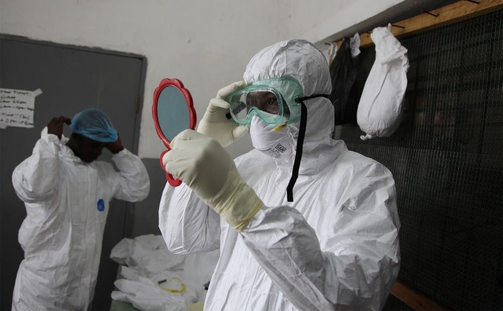 Dr. J. Soka Moses prepares to enter the Ebola ward on Oct. 10, 2014 at JFK Hospital in Monrovia, Liberia. Illustrates EBOLa-DOCTORS (category i), by Kevin Sieff (c) 2014, The Washington Post. Moved Saturday, Oct. 11, 2014. (MUST CREDIT: Washington Post photo by Kevin Sieff)