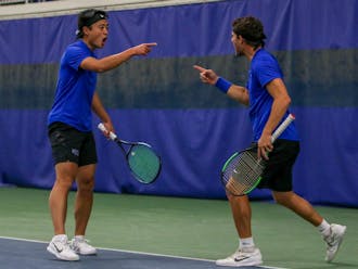 Andrew Zhang (left) and Michael Heller (right) celebrate during a Jan. 22 match against Harvard.