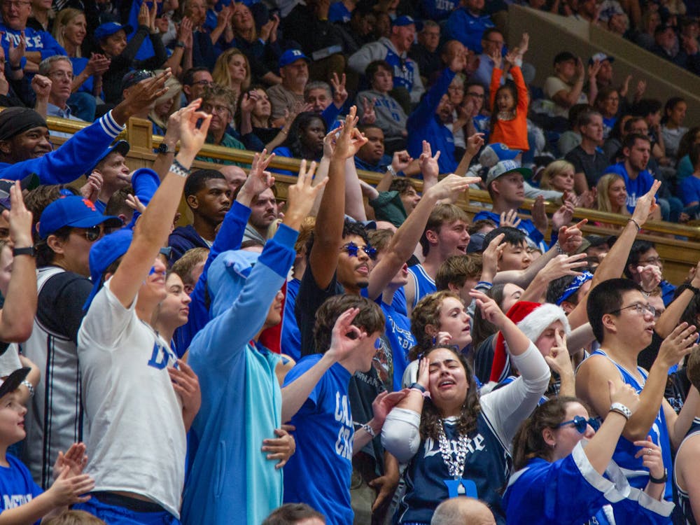 Students called Darian Mensah into the student section in Cameron Indoor Stadium Tuesday night.