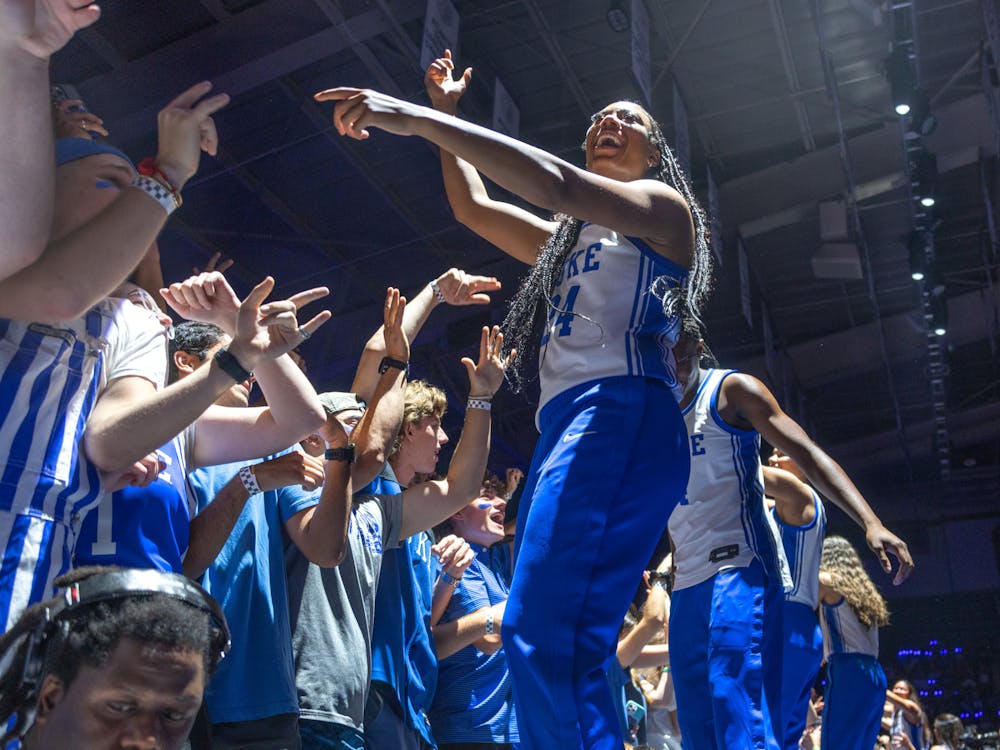 Senior Reigan Richardson hypes up the crowd at Countdown to Craziness.