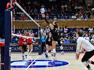 Graduate student Gracie Johnson sets the ball against N.C. State. 
