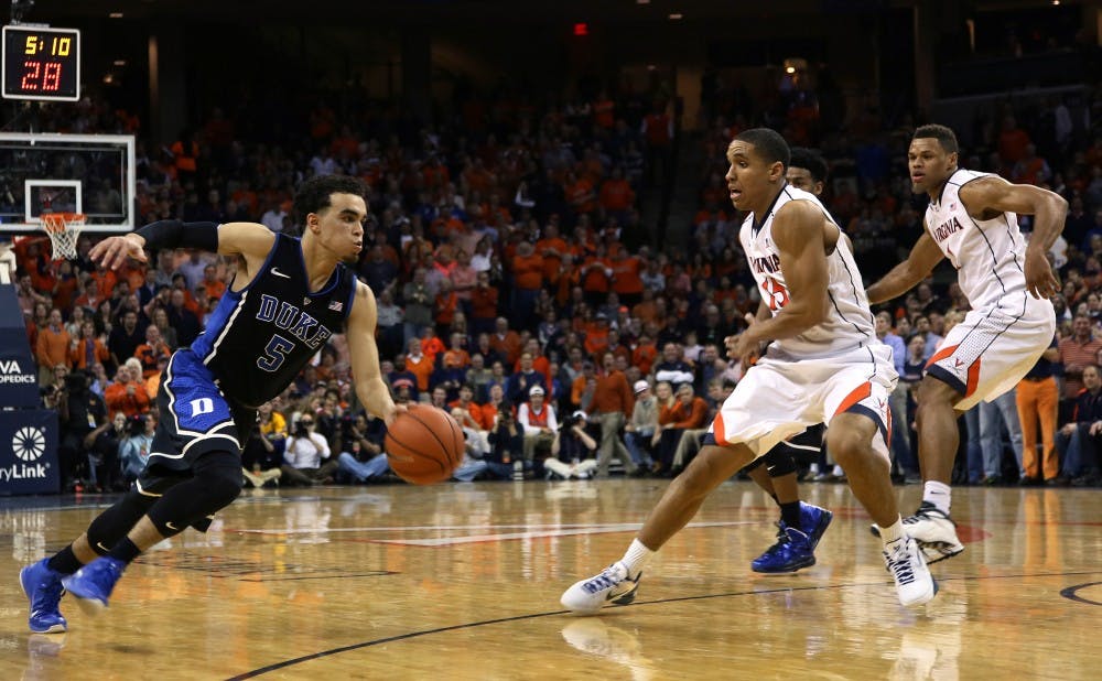 Tyus Jones led a furious run in the final 5:19 as the Blue Devils came back to stun the Cavaliers on the road.