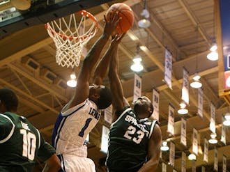 With a career-high 31 points, freshman Kyrie Irving helped Duke overcome the tenacious Spartans in a battle between the two top-ten teams at Cameron Indoor Stadium Wednesday night.