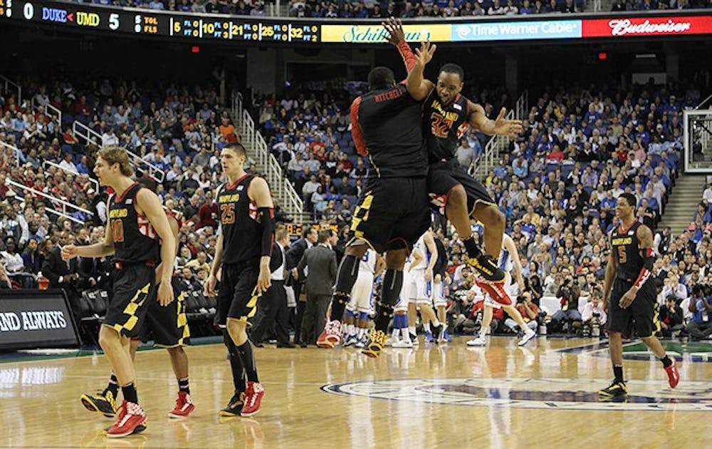 Maryland's Dez Wells, who scored 30 points, celebrates during his team's win over Duke.