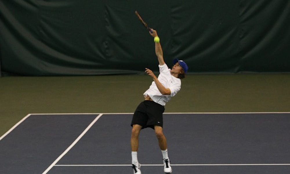 Reid Carleton struggled early in his match and lost his first set 1-6, but battled back to win, 1-6, 6-3, 6-3.