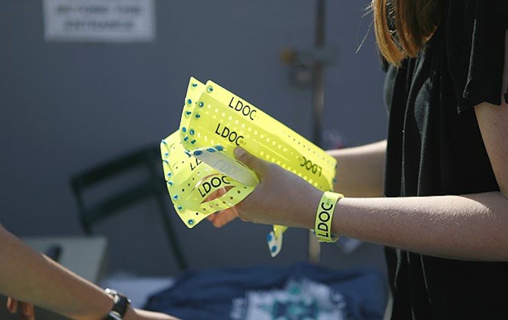 Students collect their wristbands in anticipation for the Last Day of Classes celebration.