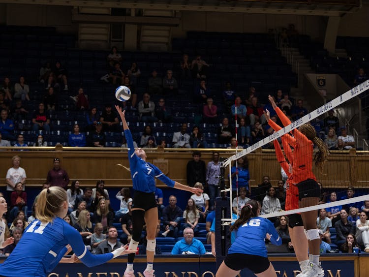 Gracie Johnson stretches upward for the ball during Duke's win against Clemson.