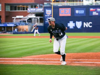 Luke Storm jogs to the dugout in Duke's April 4 win against Campbell at Durham Bulls Athletic Park.