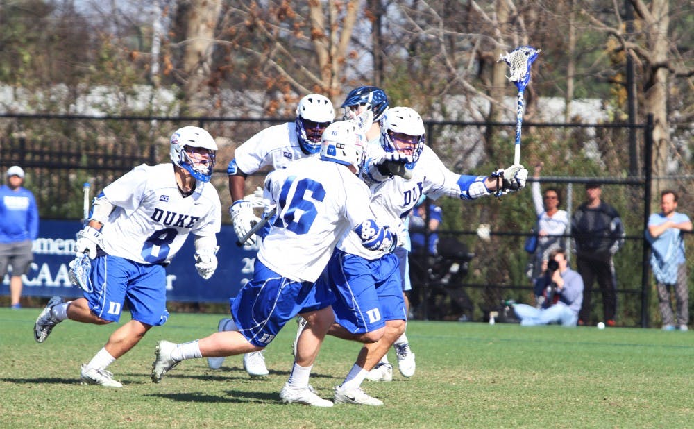 Senior Jordan Wolf’s goal with 2:34 remaining in overtime gave the Blue Devils a 9-8 victory against arch rival North Carolina.