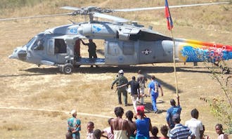 The Duke medical team in Haiti evacuates an earthquake victim via helicopter to the USNS Comfort, a navy hospital ship, for surgical treatment.