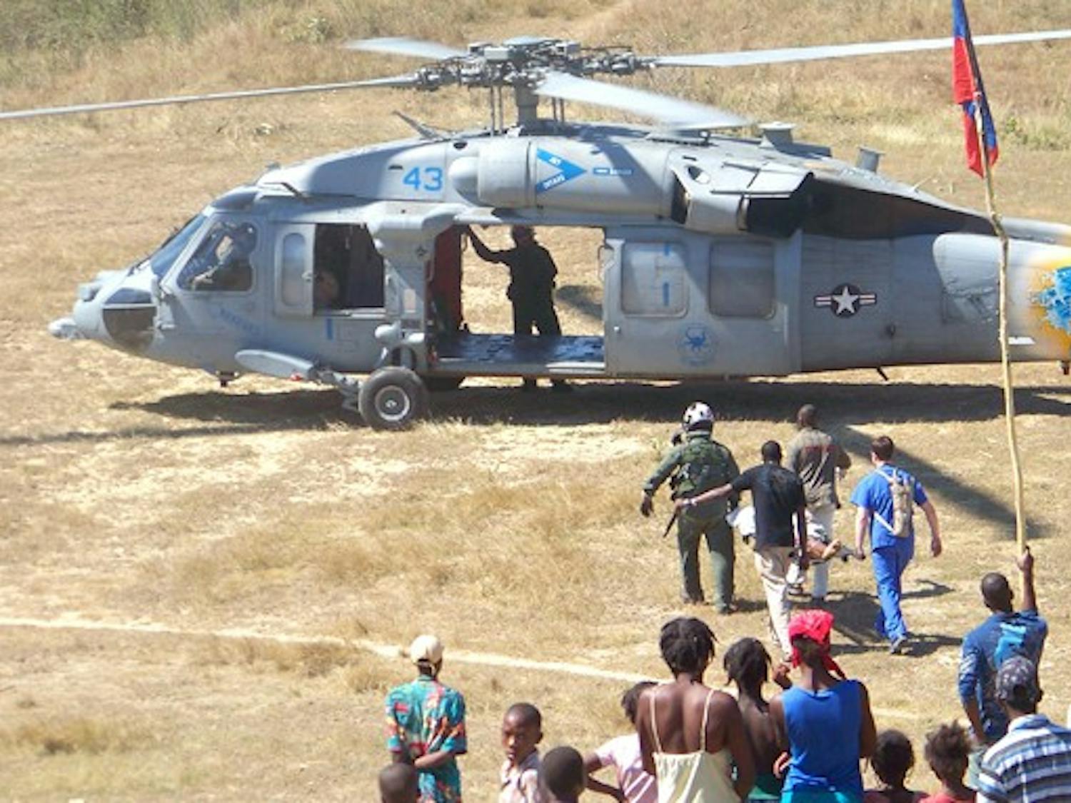 The Duke medical team in Haiti evacuates an earthquake victim via helicopter to the USNS Comfort, a navy hospital ship, for surgical treatment.