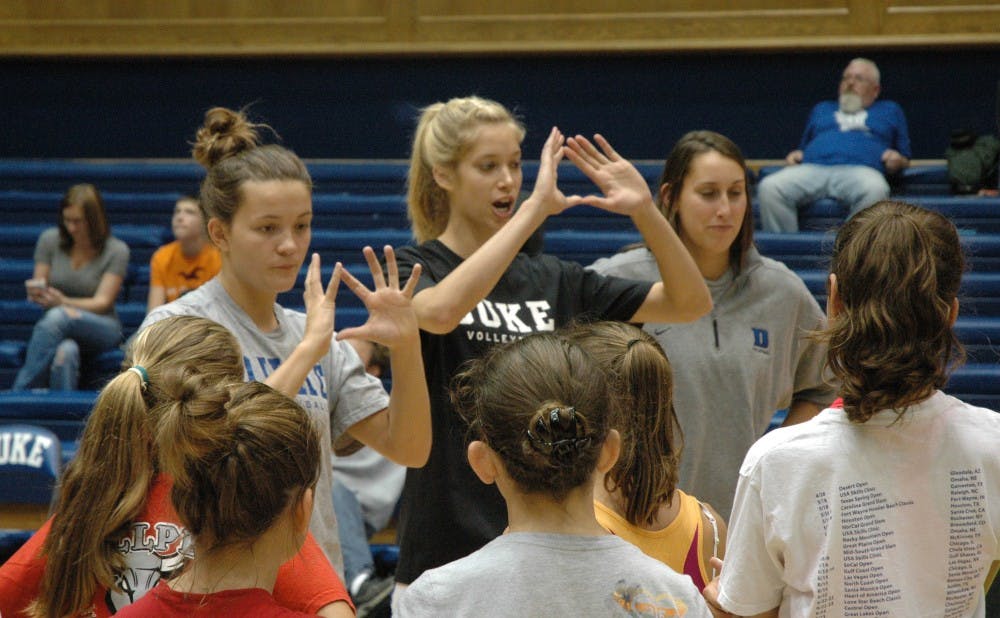 Christina Vucich (center) and the Duke volleyball team have made a habit of holding camps for young girls, and will hold another one Saturday afternoon.