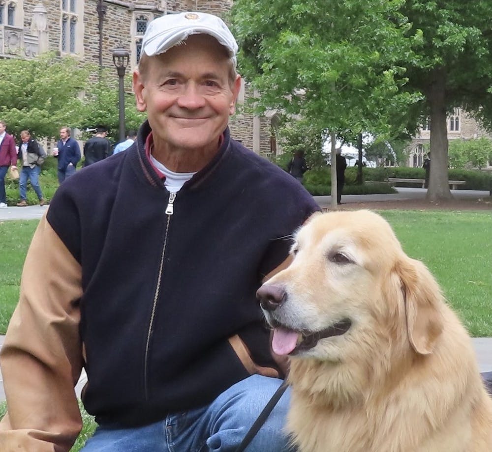 <p>Keith Upchurch and Nugget after the Class of 2022 Commencement on May 8.&nbsp;</p>