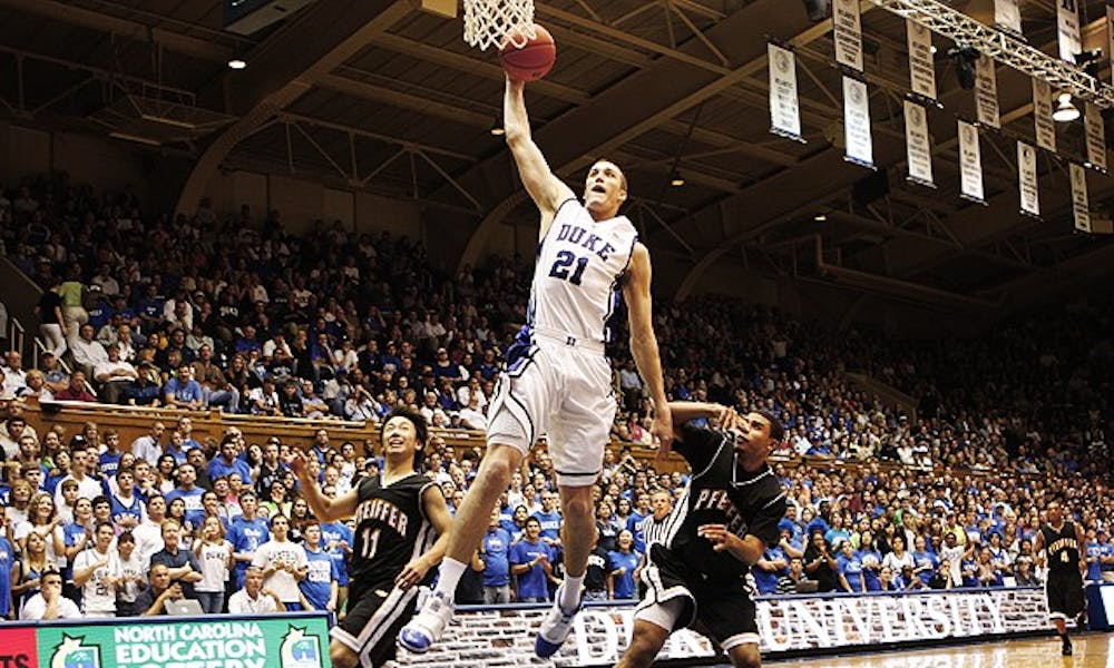 Sophomore Miles Plumlee brought the house down with back-to-back fast break slams in the second half of Duke’s 128-70 win over Pfeiffer Saturday. Plumlee scored 11 points and led the team with 14 rebounds.