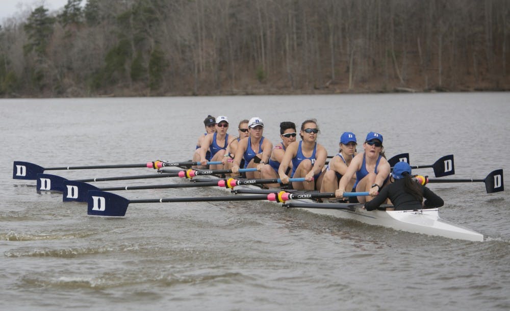 The Duke Rowing team photo and action photos on Lake Michie.