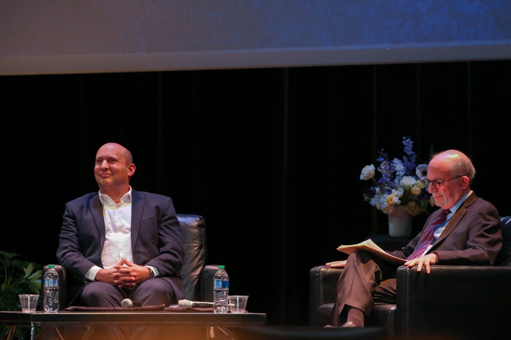 <p>Naftali Bennett, left, who served as Israel's prime minister from June 2021 to June 2022, speaking in Page Auditorium on March 23, 2023.&nbsp;</p>