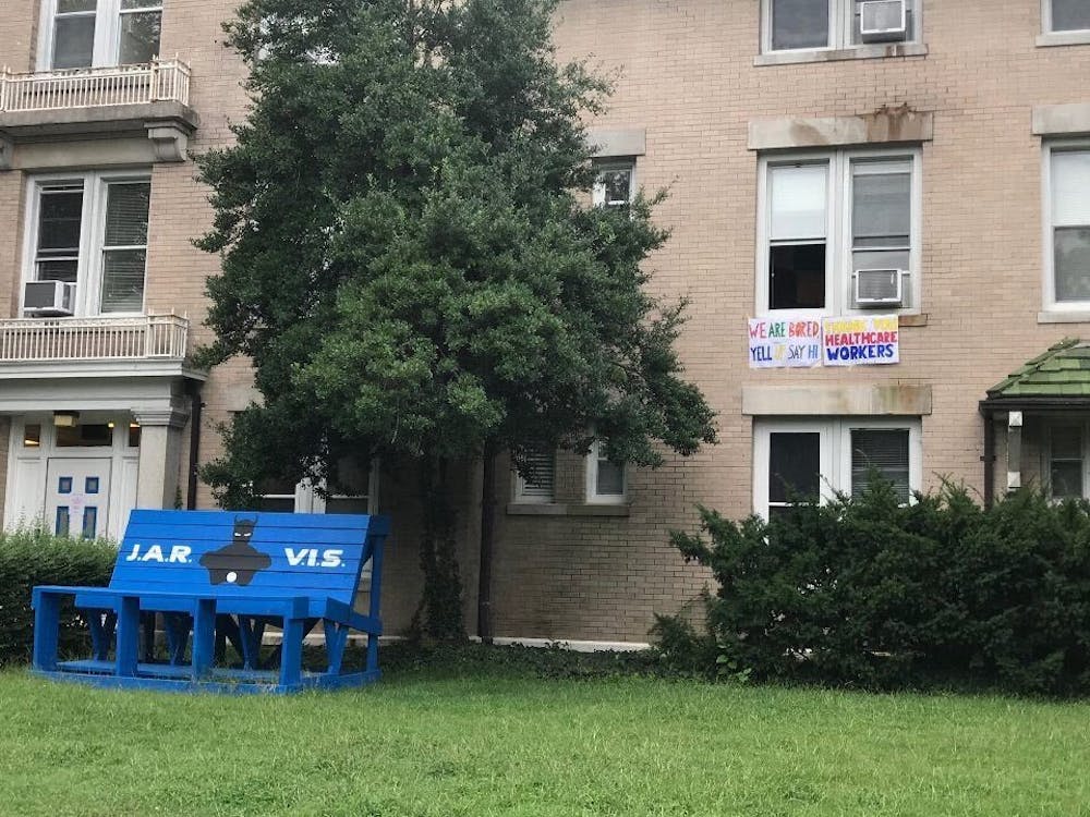 <p>A poster hanging from a window hints at Jarvis dorm's purpose as an isolation space, reading, "We are bored. Yell up to say hi."&nbsp;</p>