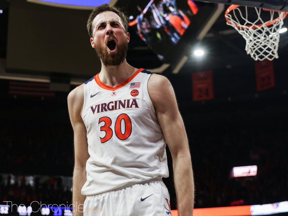 Virginia's Jay Huff celebrates as the game ends.