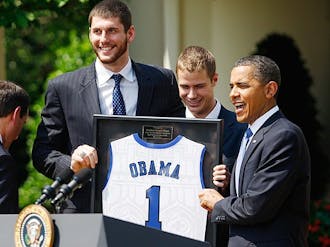 Seniors Brian Zoubek and Jon Scheyer presented Barack Obama with a No. 1 Duke jersey last Thursday.